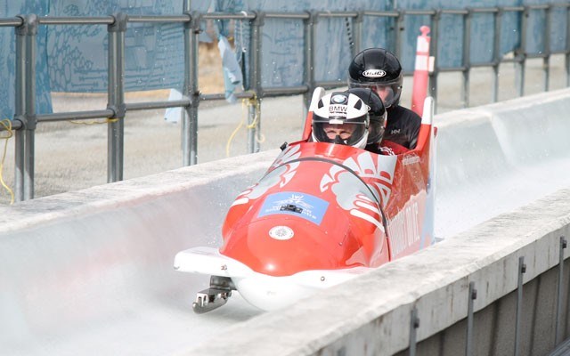 National bobsleigh athlete Justin Kripps pilots a sled with skeleton racer Jane Channell, Bobsleigh Canada Skeleton’s media and public relations director Chris Dornan and Whistler Sport Legacies CEO Roger Soane on March 23. At the event, Bobsleigh Canada Skeleton announced it has submitted a bid to host the 2019 FIBT World Championships at Whistler Sliding Centre. Photo by Dan Falloon