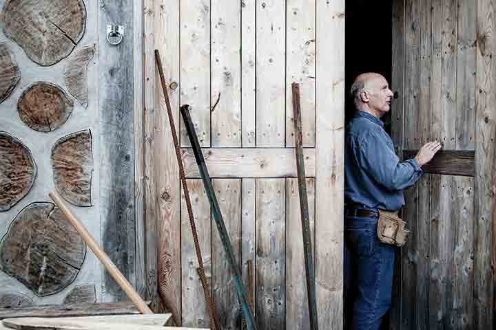 A builder works on an off-grid home in Quebec. Photo by Jonathan Taggart