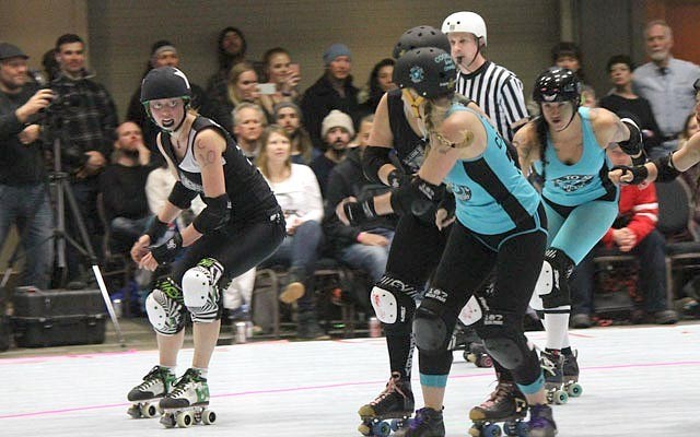 looking to pass The Black Diamond Betties' Princess Slayah (Lori O'Hare) looks to get the inside edge on some Sea to Sky Sirens during an April 11 bout. Photo by Dan Falloon