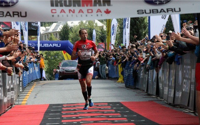 Viktor Zyemtsev approaches the Subaru Ironman Canada finish line in Whistler Village on July 26. Photo by Dan Falloon