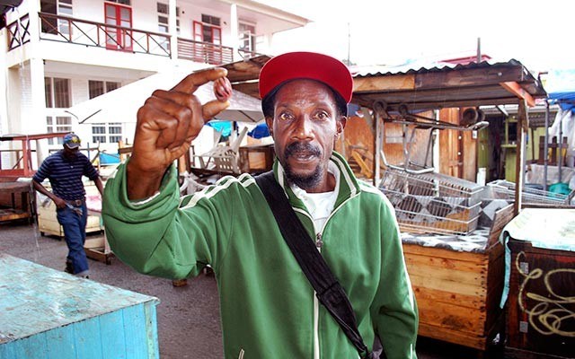 OUR SELF-PROCLAIMED tour guide at the Spice Market in St. George's, Grenada Jemmie Campbell holding up the island's most famous spice, nutmeg. Photos by Steve MacNaull