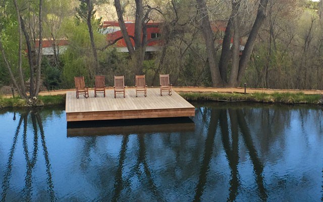 Rocking chairs at the pond provide a place to relax and reflect. Photo by Teresa Bergen