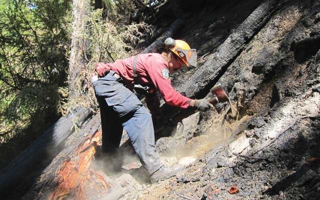 A firefighter battles the Elaho wildfire last summer. Photo courtesy of the BC WIldfire service