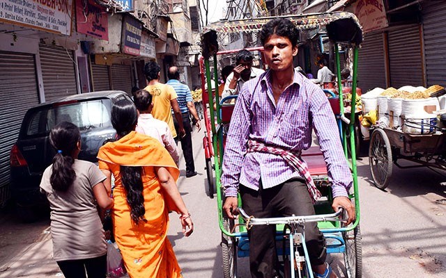 An alley teams with life in the Khari Baoli Bazaar in Old Delhi, India. Photo by Steve Macnaull