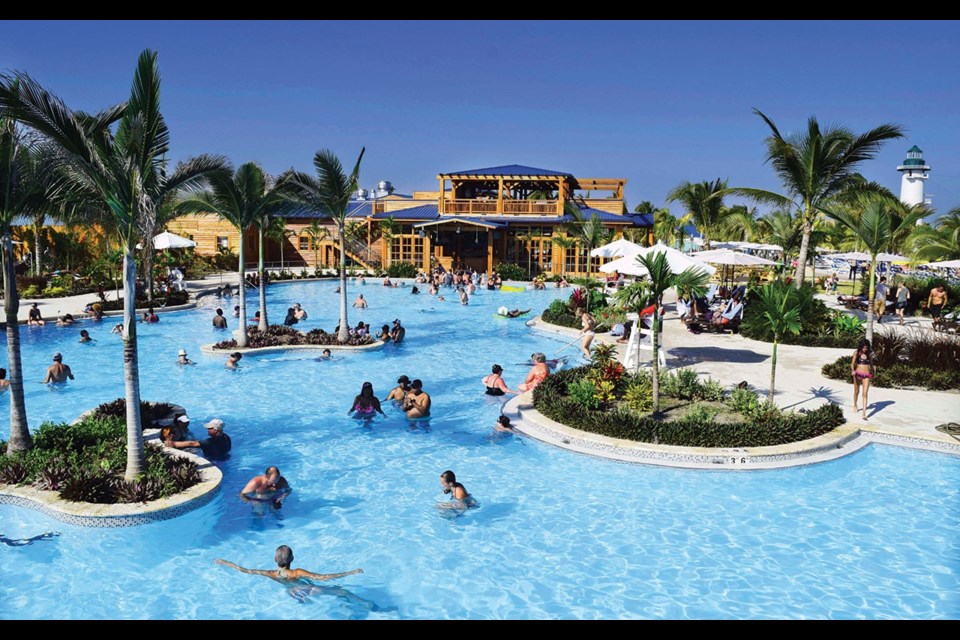 Harvest Caye features a 5,000-square-metre pool complex with swim-up bar, the largest in Belize. Photo by Steve MacNaull