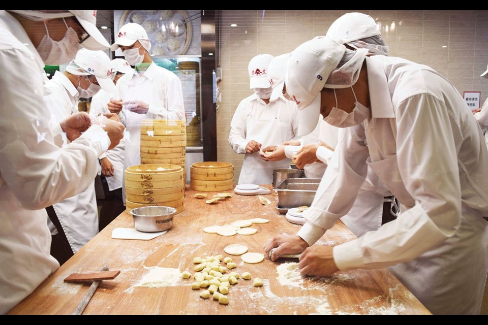 A small army of chefs makes about 15,000 dumplings a day at the flagship Din Tai Fung restaurant. top Shilin Night Market is packed with hungry shoppers, especially on a Saturday. Photo by Steve MacNaull