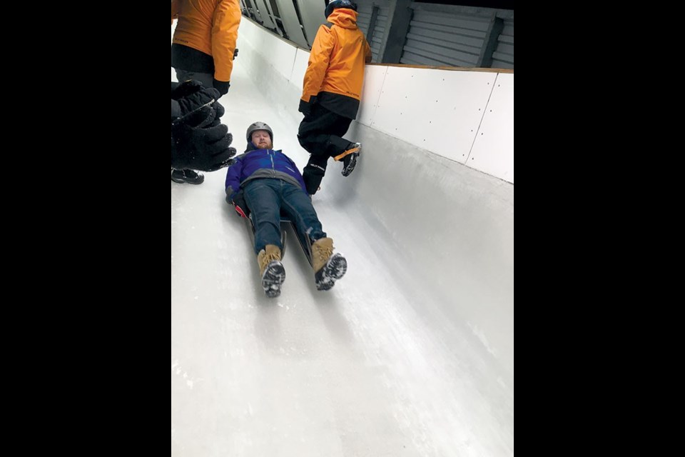 Former Pique reporter Dan Falloon begins his luge descent. Photo by Silke Jeltsch/Whistler Sliding Centre