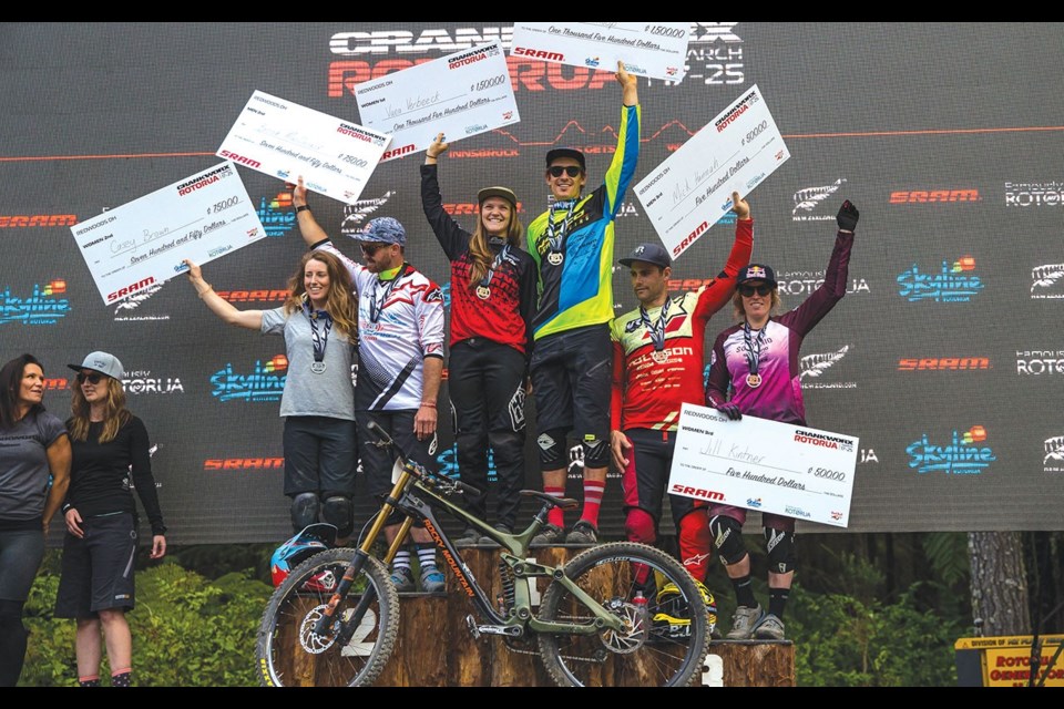 ALL DOWN HILL Canadians Vaea Verbeeck (third from left) and Casey Brown (left) hit the Redwoods DH podium at Crankworx Rotorua on March 18. Photo by Fraser Britton/Crankworx 2018