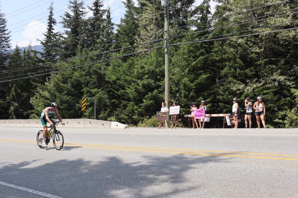 IRON FANS: Fans braved the heat to cheer on competitors during the cycle portion of the 2018 Ironman Canada triathlon. Photo by Megan Lalonde