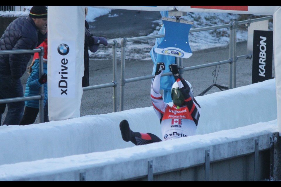 RELAY THE MESSAGE Whistler's Reid Watts punches through the finish during the team relay event at the Viessmann Luge World Cup at Whistler Sliding Centre on Dec. 1. Photo by Dan Falloon