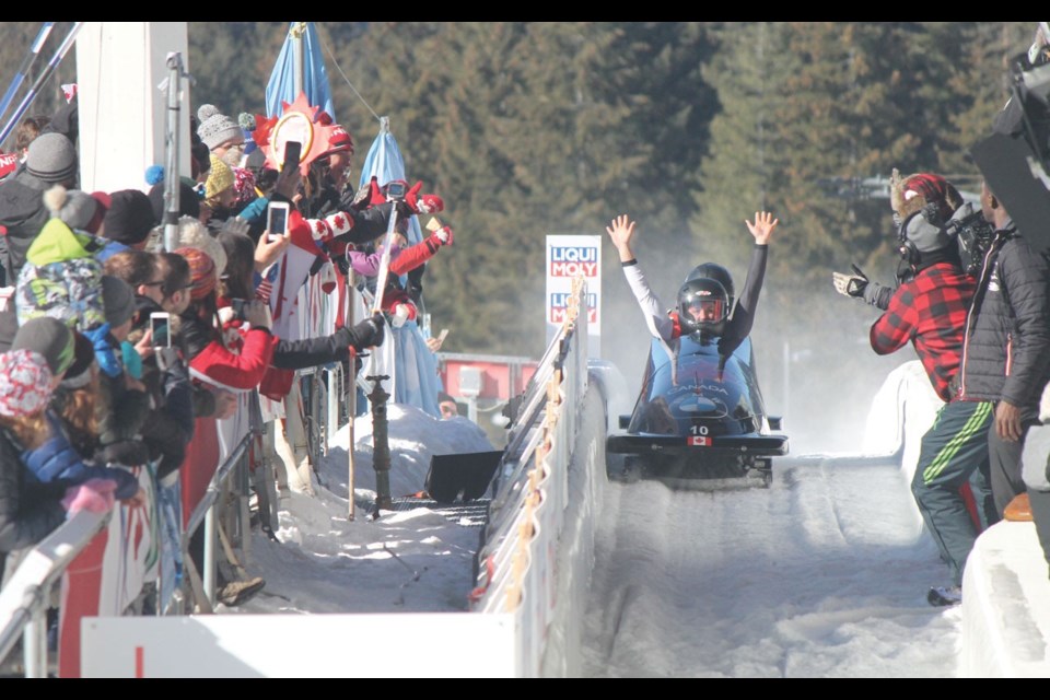 LOTS TO CELEBRATE Christine de Bruin and Kristen Bujnowski celebrate their bronze-medal finish at the BMW IBSF World Championships on March 3, de Bruin s birthday. Photo by Dan Falloon