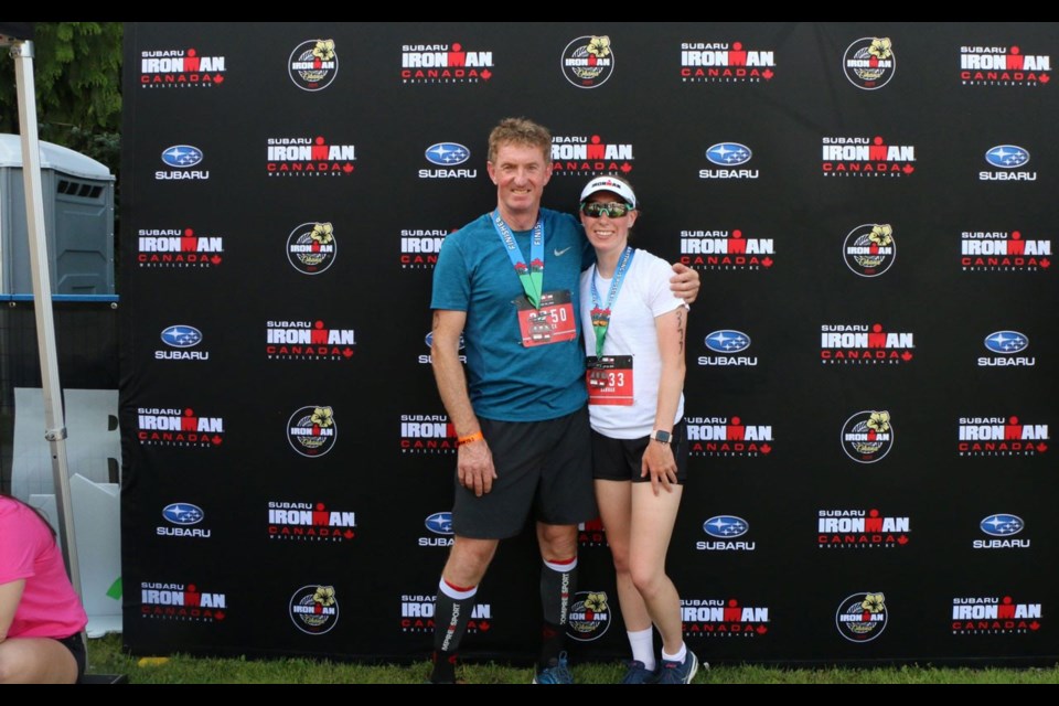 FINISHING OFF Hannah Peatfield (right) with father Mick, was the youngest racer in the Ironman Canada 70.3 on July 28. <ParaStyle:CUTLINE\:CUTLINE Credit>Photo submitted