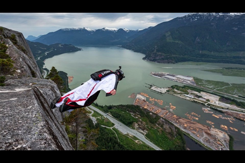 Jamie Flynn steps off the Stawamus Chief. By 2016, he had base jumped 1,000 times. He has since stopped counting. Photo by James Frustak