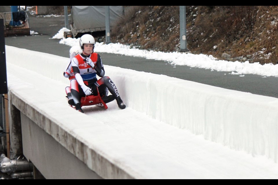 COMPLETING THE RUN Caitlin Nash and Natalie Corless complete their second run at the Viessman FIL World Cup on Dec. 14. <ParaStyle:CUTLINE\:CUTLINE Credit>Photo by Dan Falloon