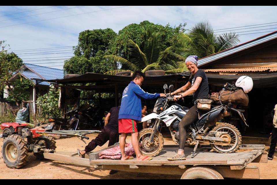 Tuk-tuk ride to the nearest flat repair shop. Photo by Tim Morch