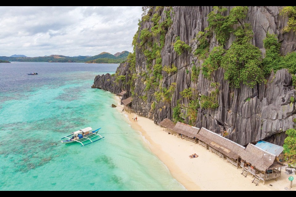 Aerial view of Banol Beach on paradise island, Coron, Palawan, Philippines - tropical travel destination. Photo by Simon Dannhauer / gettyimages.ca