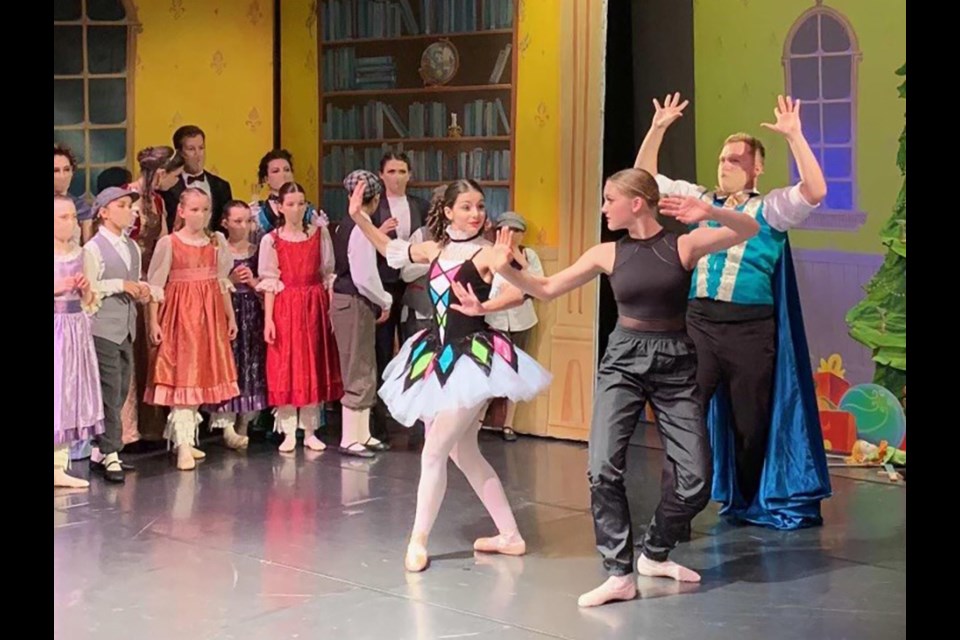 Georgia Malamas [in white with green, pink and blue] and Katie McKamey [in black] rehearsed for months to be ready as cast members of the Sunshine Coast Nutcracker.