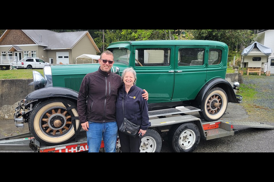 LONG JOURNEY BEGINS: Oldrich Blaha [left] picked up a 1930 McLaughin and readied it for the trip to the Czech Republic where its new owner lives. Jan Gisborne was at the handover on behalf of her husband Stan.