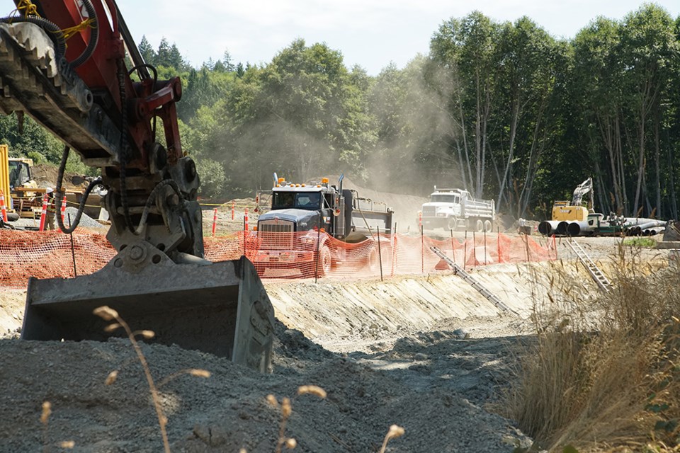 DIGGING IT: Work is underway at the consolidated wastewater treatment plant, with excavation and the hauling of soil taking place at the construction site just above the Catalyst Paper log pond in Townsite.                               