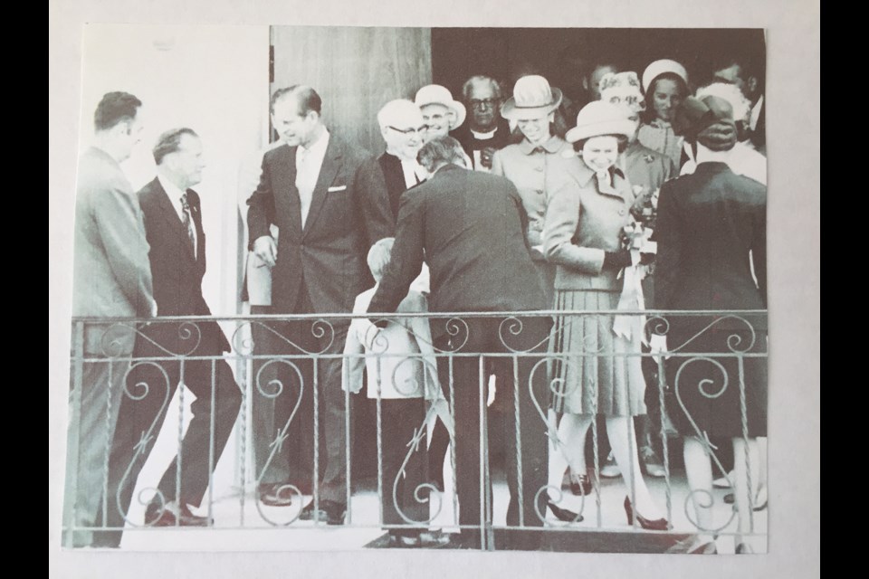 AT THE ENTRANCE: Queen Elizabeth II, right, with Princess Anne behind her at the front doors of Powell River United Church in 1971. Prince Phillip second left next to Reverend Roy Rodgers.