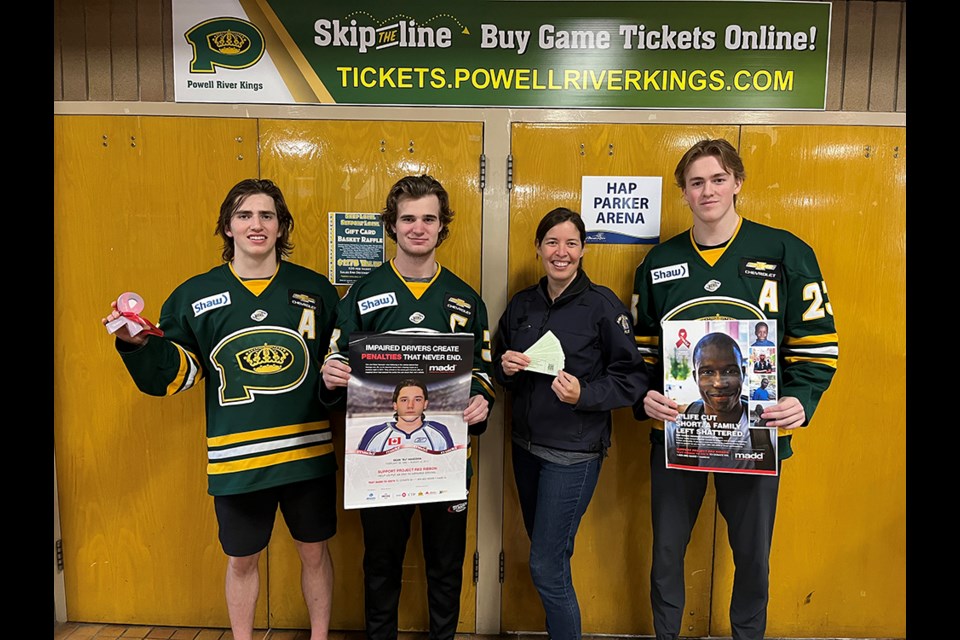 WORKING TOGETHER: Powell River Kings' players [from left] Karter McNarland, Sam Schoenfeld and Casey Aman, along with Powell River RCMP constable Paula Perry, are supporting the holiday CounterAttack program to help keep impaired drivers off the roads. Kings' tickets will be given out by RCMP members during road checks during the campaign. Also, to kick off the campaign, there will be a member of the local RCMP detachment dropping the puck at the December 3 Kings/Cowichan Valley Capitals game at Hap Parker Arena.