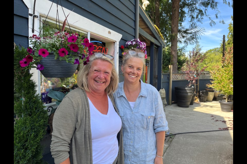 ZEN GARDEN: Springtime Garden Centre manager Liz Quigley [left] and service representative Jen Vasseur are always happy in the garden.