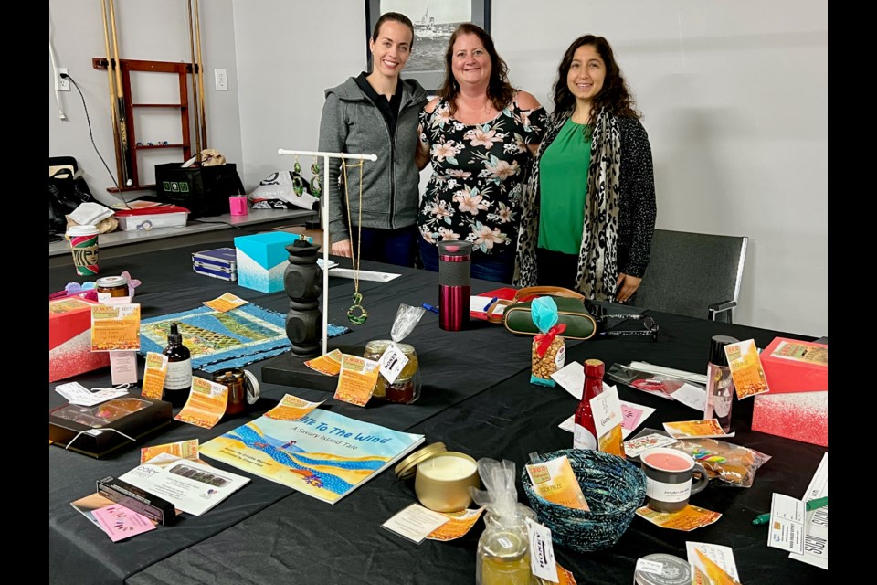 COASTAL COMPETITION: Participants at the Coastal Women in Business artisan and entrepreneur show voted for best in show; there were also door prizes given away. [From left] Coastal Women in Business board members Karina Inkster, events director; Cheri Lynn Wilson, president; and Hala Romana, vice president.
