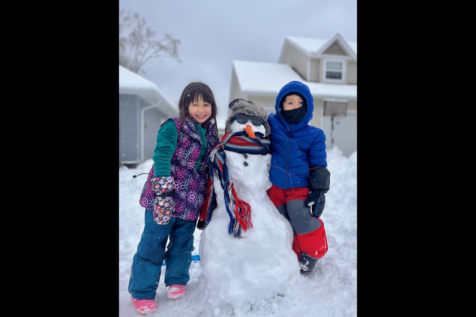 AND THE WINNER IS: Michif (Métis) snowman completely built by Ember-Ling, seven [left] and Emerson, five, submitted by their father.
