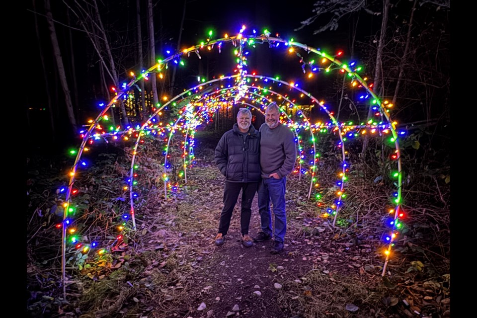 FOREST LIGHTS: Mitch Kenyon [right] and Brian McRae have created a holiday lights walk called the Enchanted Christmas Forest, which is open to the public, beginning December 17.
