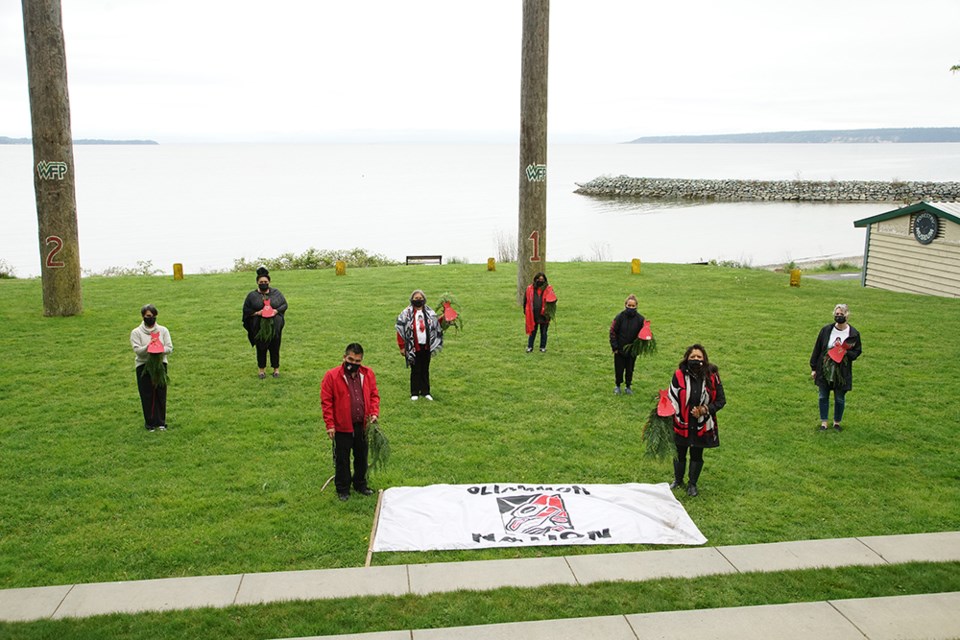 [From left] Jen Ramsay, Powell River and Region Transition House Society; Losa Luaifoa, executive councillor Tla’amin Nation; Randolph Timothy Jr., coordinator of the Family Tree program; Doreen Hopkins, Tla’amin elders coordinator; Angela George; Amy Timothy; co-organizer Cyndi Pallen (Chenney); and Annette Mennitti (transition house society) prepared for the missing and murdered indigenous women walk at Willingdon Beach, with cedar boughs and red dresses to mark the trails.