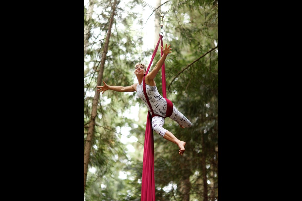 AERIAL ARTIST: Keely Sills, one of nearly 40 locals performing in a circus in the forest, moved from dancing on the stage to dancing in the air.