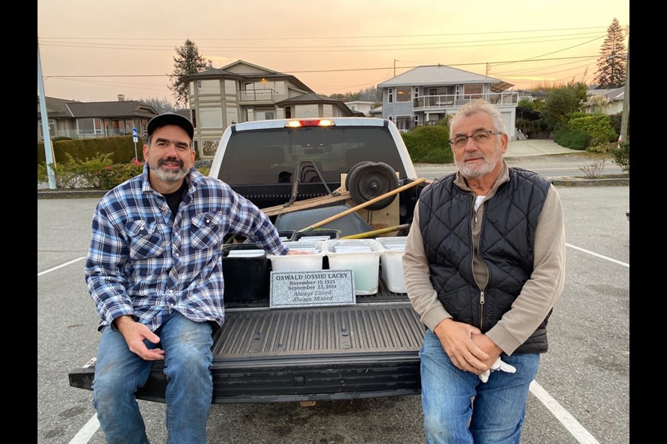 MEMORIAL BRICKS: Rotary Club of Powell River secretary Sean Dees [left], and friend of Rotary Charlie Gatt, installed a new batch of bricks at the Westview viewpoint. The bricks are an annual fundraiser for the club that undertakes projects in the community and around the world.
