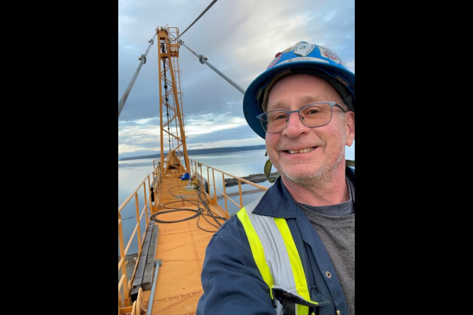 THE AIR UP THERE: Crane operator Rob Predinchuk spends his work days high above the consolidated wastewater treatment plant under construction in Townsite.
