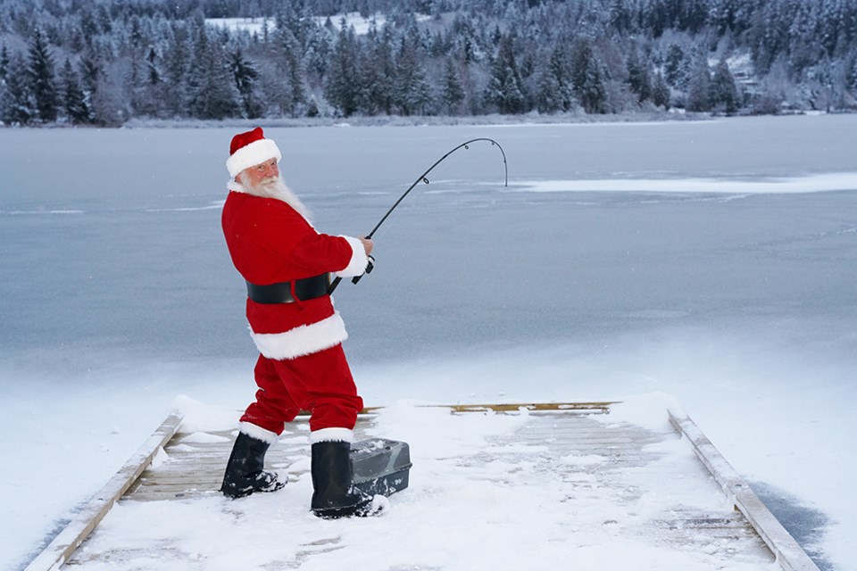 CATCHING TROUT: Out for some early morning fishing on December 20 was Santa Claus, who tried out the new fishing pier on Cranberry Lake, which is accessible by traversing a short trail that has the trailhead at Marlatt and Park avenues. The pier is an ideal spot for children to cast a line, as well as for seniors or people who don’t have a boat but would like to try fishing in the lake.