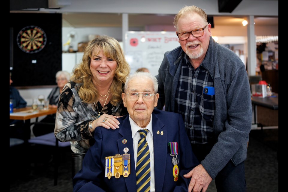 SERVICE RECOGNITION: Longtime member Chuck Sparks, seated above with his daughter Diane and son Tom, was presented with a medal of honour by Royal Canadian Legion Branch 164 at a recent ceremony.