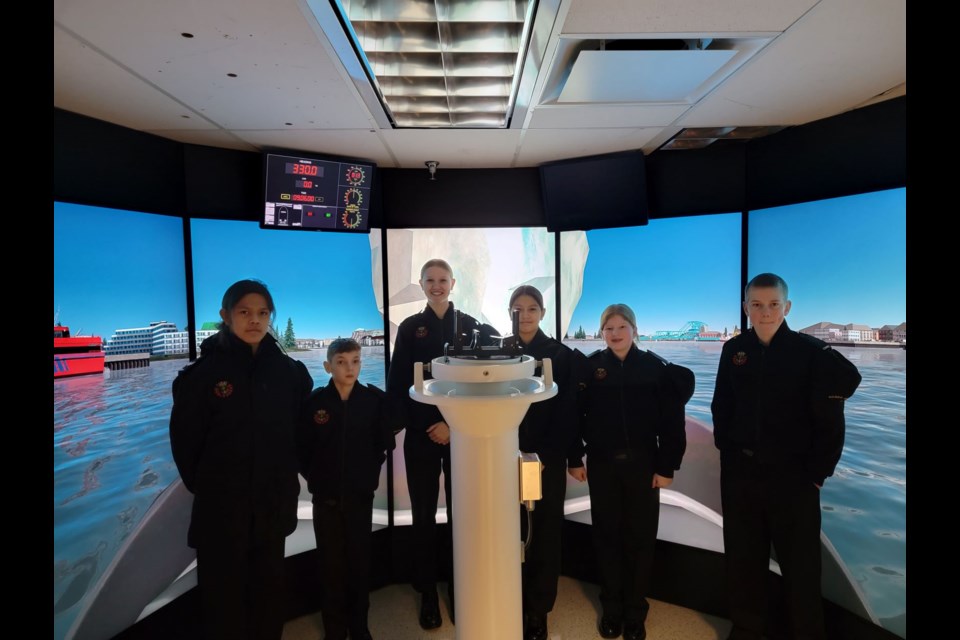 BRIDGE SIMULATOR: Sea cadets LC Daniel Gilbert, from Campbell River [left], and OC Brody Williamson, CP02 Shelby Pauls, AB Marlina Hanson, OC Makenna Plisson and OC Asher Bratseth from 64 RCSCC Malaspina (Powell River) took part in a bridge simulation exercise at CFB Esquimalt.