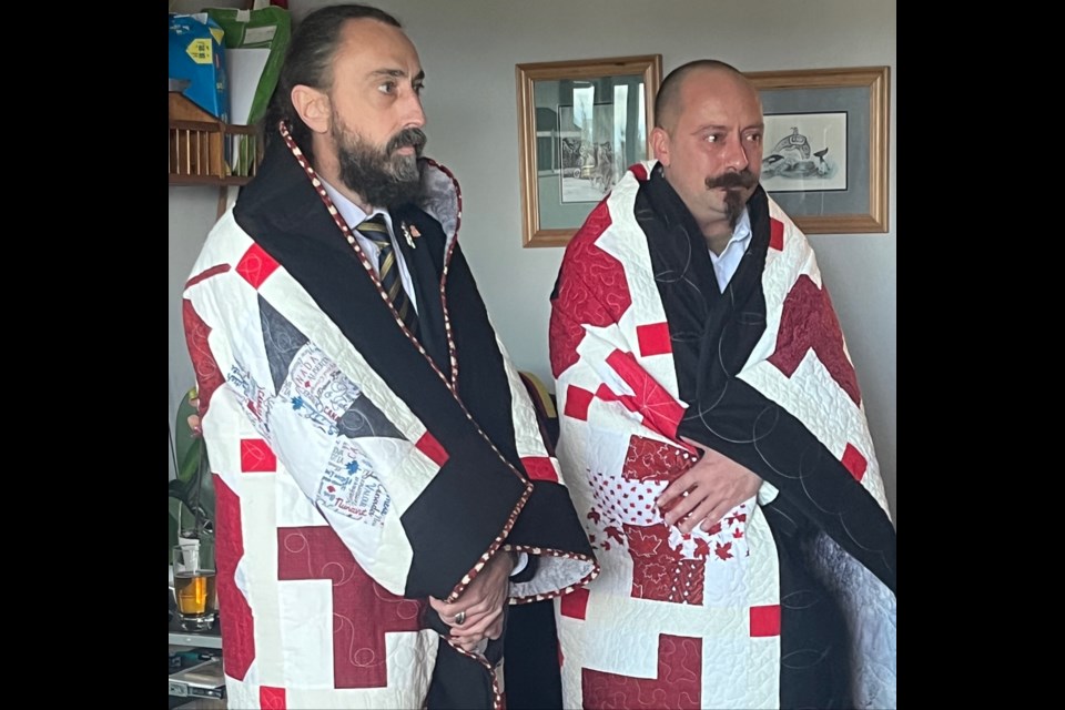 HONOUR QUILT: [left] Retired military sergeant, CD, Jason Hygaard, and retired Warrent officer, CD, Michael P. Koestlmaier, received a Quilt of Valour on Saturday, March 25.

