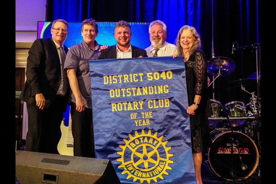 ROTARY AWARD: [From left] current Rotary Club of Powell River president Ross Cooper and members Dave Gustafson, Matt Wate, Dan De Vita and Jan Gisborne accept the award for Outstanding Rotary Club of the year in District 5040.

