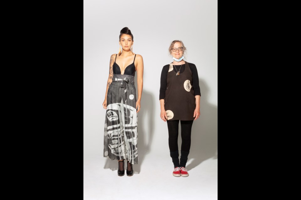 HAND-PAINTED: 68-year-old eco-fashion designer, grandmother and qathet resident Wendy Van Riesen [right], with a model wearing one of her dresses.