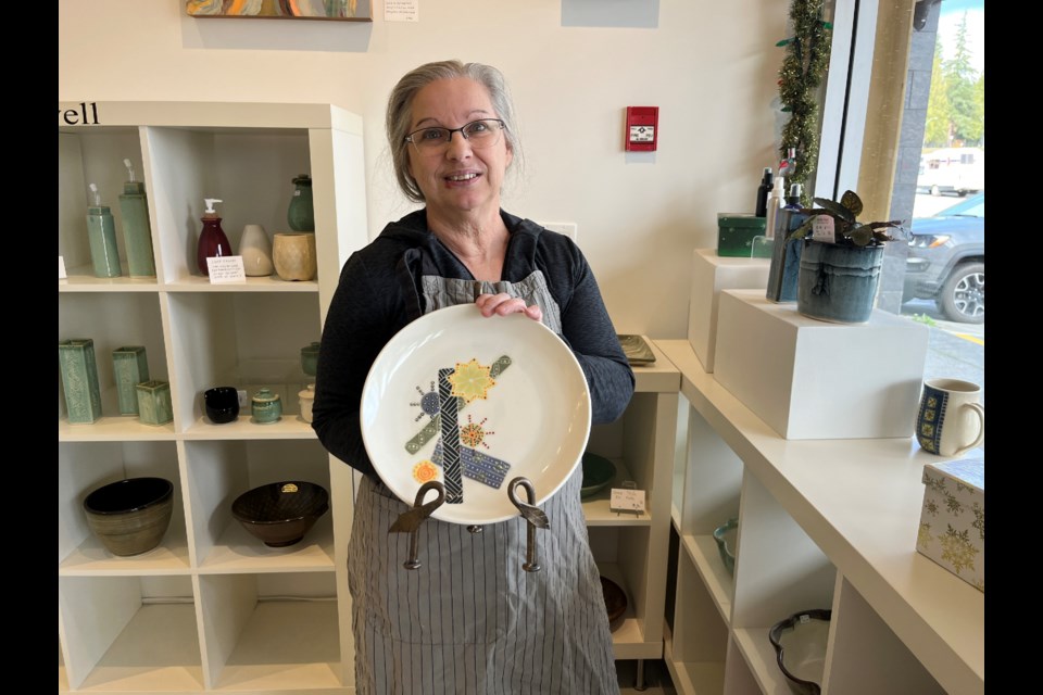SPECIAL PLATE: Potter Darlene Calwell made a special holiday plate out of porcelain.
