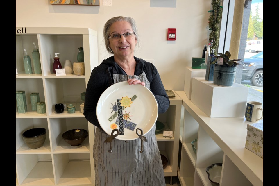 SPECIAL PLATE: Potter Darlene Calwell made a special holiday plate out of porcelain.
