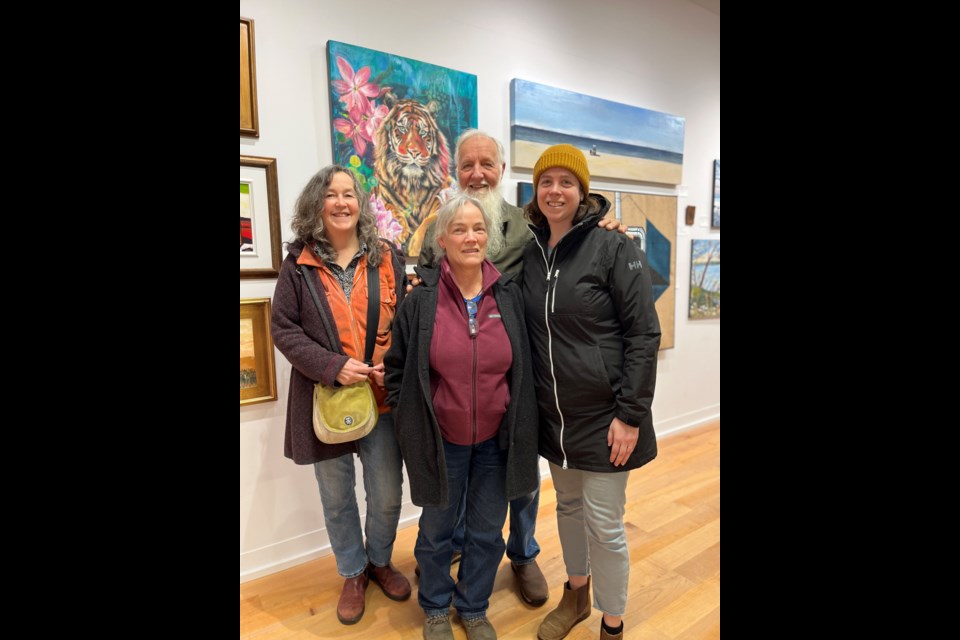 FINAL DAY: PRESENT, a qathet resident group exhibition at qathet Art Centre, took place above Powell River Public Library, beginning last November. January 10 was the last day. Artists who participated in the group exhibit had a chance to meet other artists and chat about their work at the gallery. [From left] Lund painter Monique Labusch, Val Schuetze, painter Doug Schuetze and artist Wild Kat all had art work up and for sale.