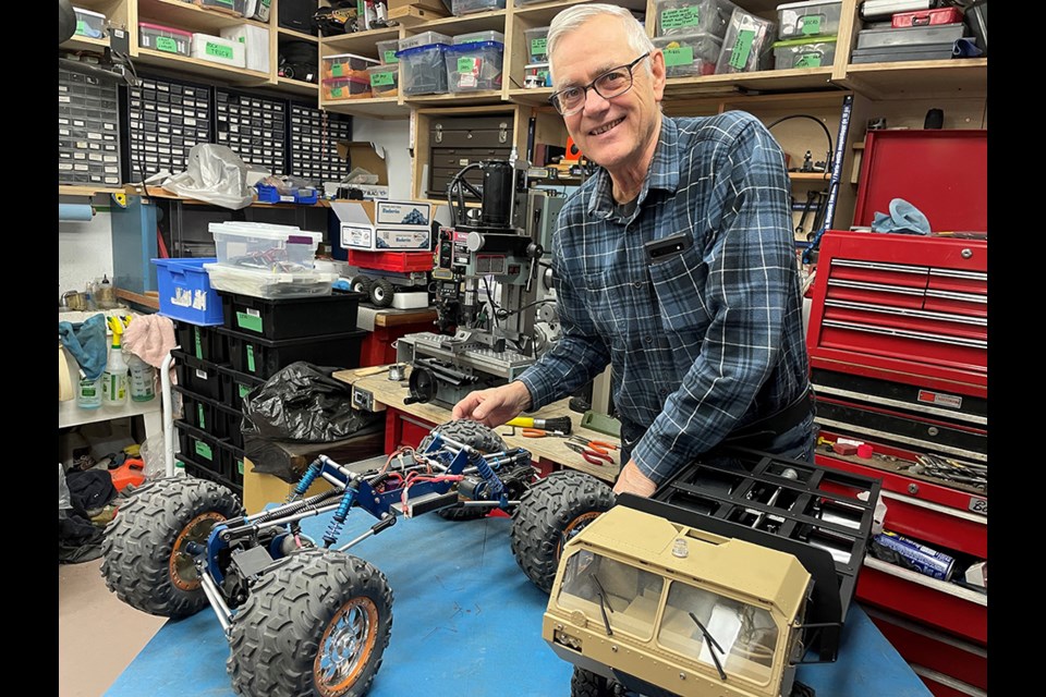 NEWEST AND OLDEST: Andre Dalcourt combined his professional and hobby lives with his passion for fabricating. The remote-controlled vehicle on the left has parts from 30 years ago; on the right is his latest project.