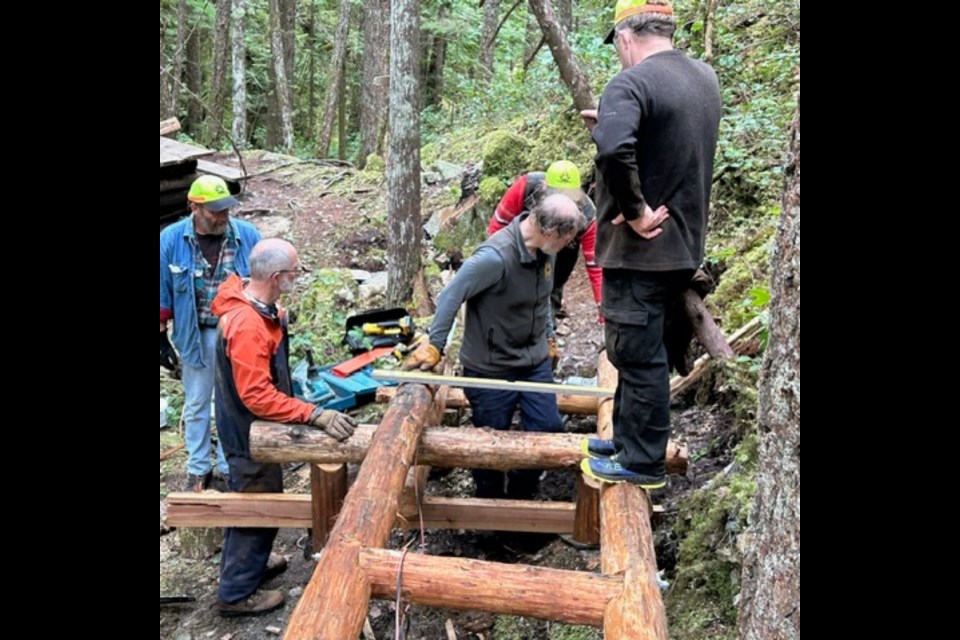 TRAIL BUILDING: qathet Parks and Wilderness Society directors recently built the new bridge at Appleton Canyon. qPAWS is a registered nonprofit charitable society.