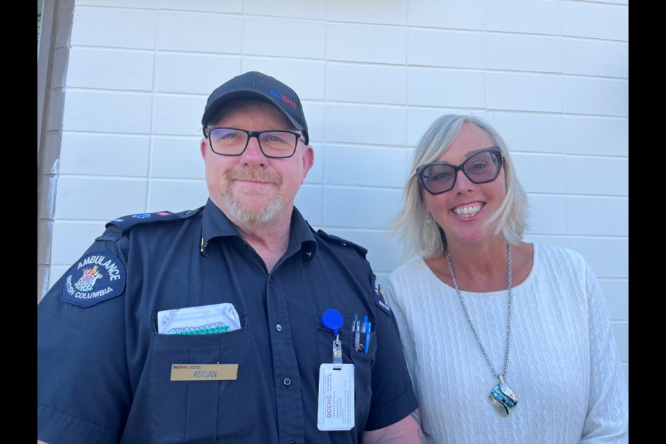 HELPING OUT: Local optician Helen Whitaker [right] offered to replace paramedic Adrian Ralph’s prescription sunglasses after his pair went missing while he was out on a call.