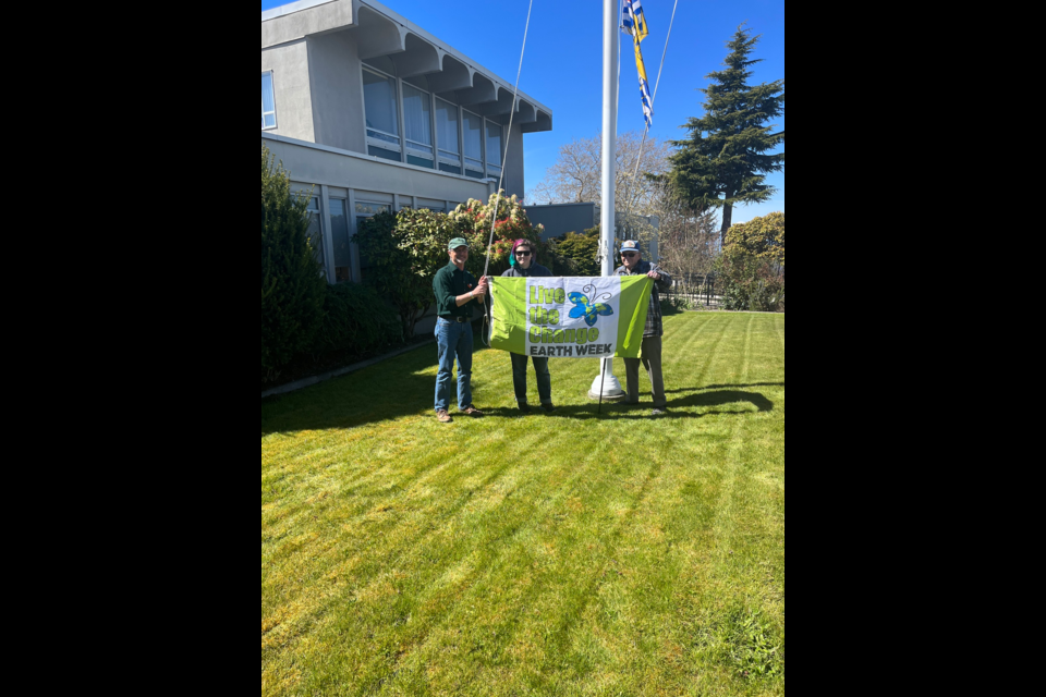 EARTH MONTH: City of Powell River invited residents to gather for a public raising of an Earth Day flag at Powell River City Hall at noon on Monday, April 22. Councillor and acting mayor Rob Southcott [left] commemorated Earth Day/week/month by speaking about how the first Earth Day came to be more than 50 years ago.