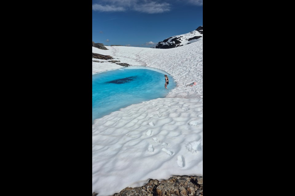 SUMMER SWIM: Hiker Amanda Hagglund went for a swim in a frigid pool of blue water on July 1.
