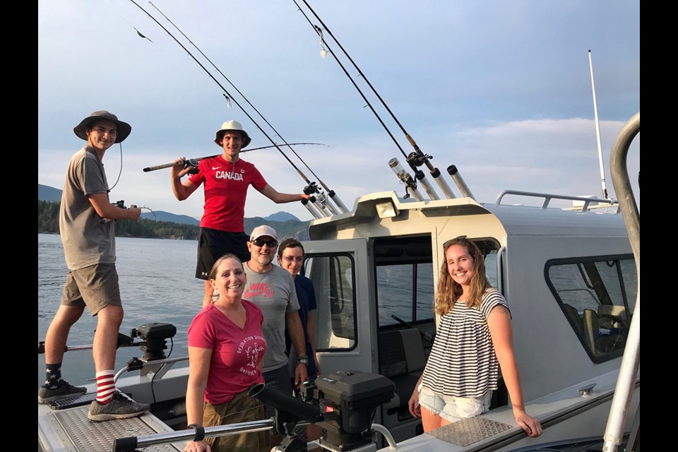 OFF-GRID AFICIONADOS: The Normandeau family on their boat, the Northern Twilight, fishing in Desolation Sound.