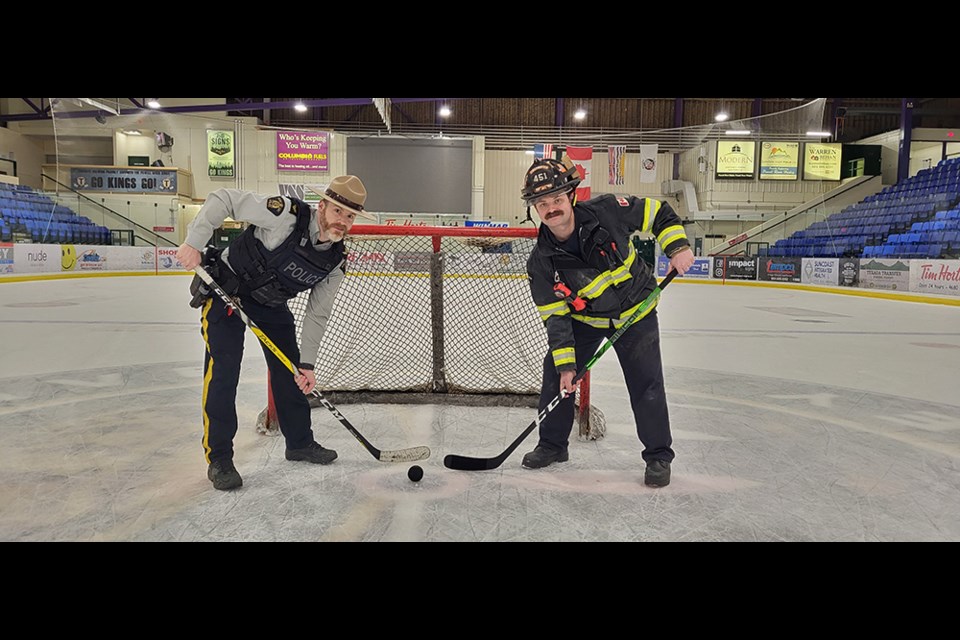 FACE OFF: RCMP corporal Phil Caza [left] and firefighter Sid Allman [right] are organizing a charity hockey game between their two departments to benefit Cops for Cancer’s Tour de Coast 2022. Proceeds from the game will support pediatric cancer research and Camp Goodtimes.