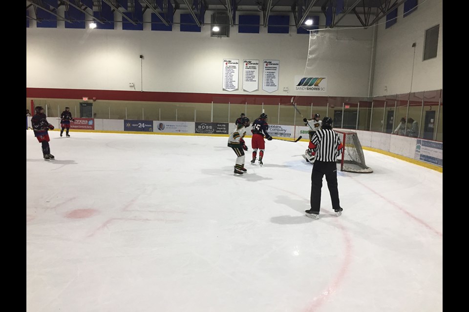 Powell River U18 Kings' forward Liam Carroll raises his stick to celebrate his second goal of the game against Oceanside on September 17.